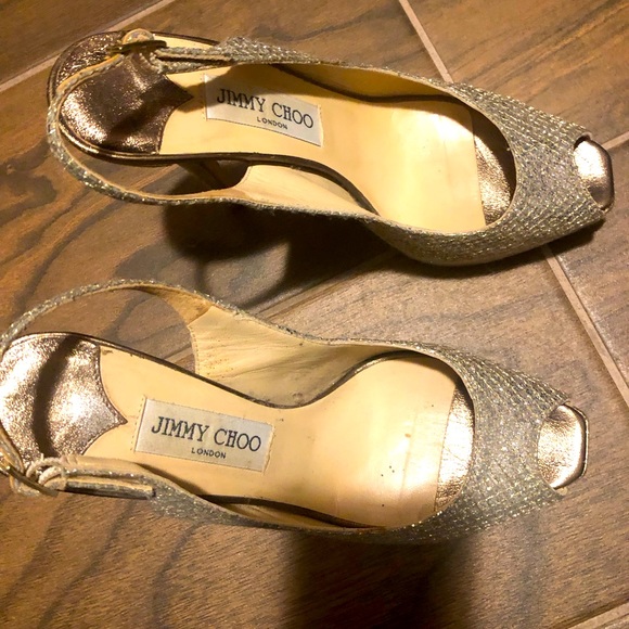 Jimmy Choo Shoes - Jimmy Choo Pumps
Patent Leather Trim
Peep-Toes with Glitter Accents
Stiletto